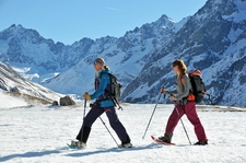 Hikers snowshoeing above Villar d'Arène - © Bertrand Boone